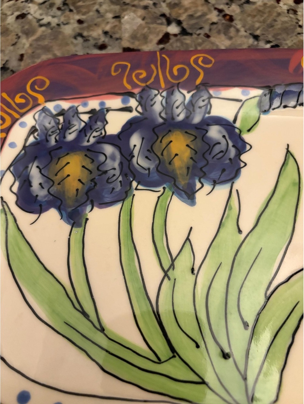 This is a 1996 hand-painted ceramic decorative dish designed by Debra Cheriawsky